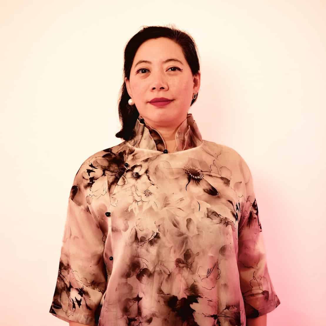 Woman at AAPI History Museum First Anniversary event, celebrating Asian American history.